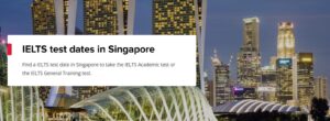 A web banner promoting IELTS test dates in Singapore. The text overlay reads "IELTS test dates in Singapore" and "Find a IELTS test date in Singapore to take the IELTS Academic test or the IELTS General Training test." The background is a nighttime panoramic view of the Singapore skyline, featuring modern skyscrapers and architectural elements. The IELTS logo is visible as a small red square on the left. This banner is likely from an organization offering IELTS preparation or testing services in Singapore.